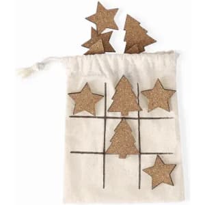 A cotton bag containing cork star and tree shapes for a game, with additional shapes displayed above the bag.