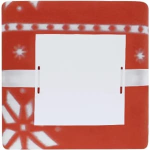 A red and white patterned blanket with a section for a label or tag in the centre.