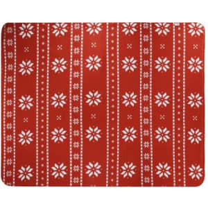 A festive red mat featuring white snowflake patterns and stripes. It has a decorative design suitable for seasonal decor.