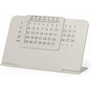 A desk calendar in a cream colour, featuring a simple design with numbers and days of the week, and a stand.
