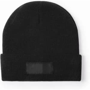 A black beanie hat with a folded brim and a patch area for branding or embellishment.