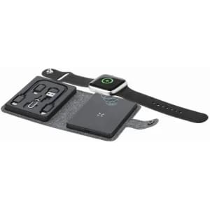 A smartwatch in black with a charging pad and various cables on a grey felt tray, featuring a brand logo.