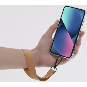 A phone case with a leather strap held in a hand, featuring a vibrant screen display. The case has a clear design.
