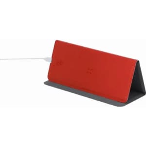 A red charging pad with a grey base, featuring a logo and a charging cable connected.