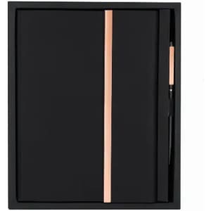A black notebook with a rose gold accent and a matching pen, presented in a sleek black box.