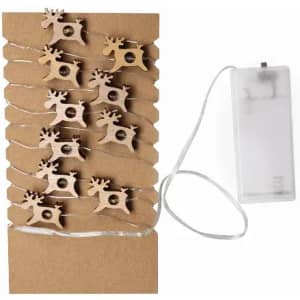A string of wooden reindeer decorations attached to a battery-operated light source on a cardboard backing.