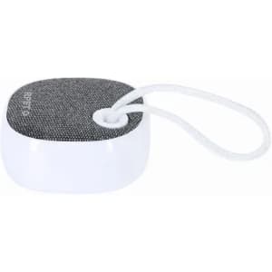 A portable speaker with a white base and grey fabric top, featuring a looped strap for easy carrying.