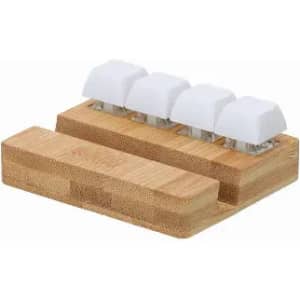 A bamboo docking station with four white key-shaped holders for organising items.