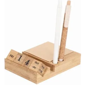 A wooden desk organiser featuring a date calendar, notepad, and compartments for pens in natural tones.