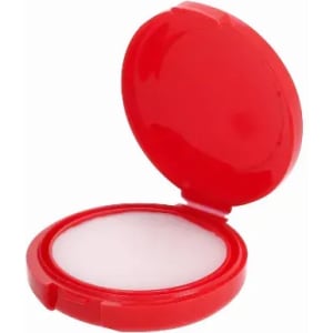A compact powder case in bright red, featuring a hinged lid and a white powder compartment.