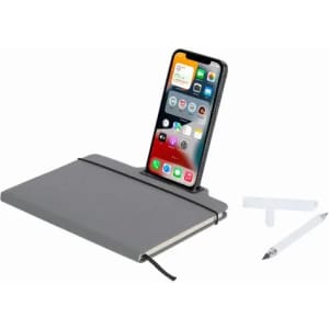 A grey notebook with a phone stand, a smartphone, a stylus, and two connectors positioned beside it.