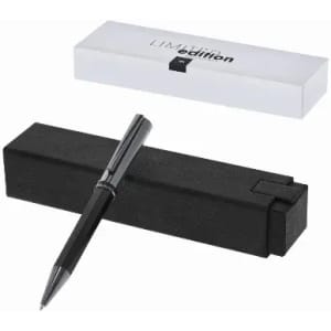 A black pen resting on a black box, accompanied by a white box in the background. The pen has a sleek design.