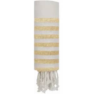 A decorative towel in white with gold stripes, featuring frayed edges at the bottom. It has a subtle branding logo.
