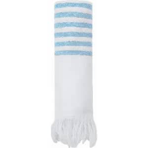 A white towel with blue and white striped design at one end and fringed edges. It features a simple, elegant style.