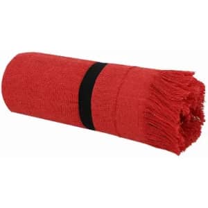 A rolled red towel secured with a black band, featuring fringed edges.