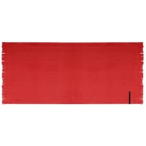 A vibrant red blanket with fringed edges and a logo at one end.