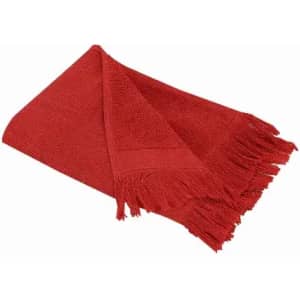 A red towel with a textured surface and fringed edges, folded neatly.