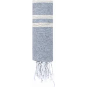 A blue and white striped towel featuring fringe at the ends and rolled up for storage.