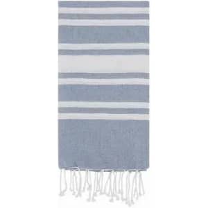 A blue and white striped towel with fringed edges, featuring alternating bold and thin stripes.
