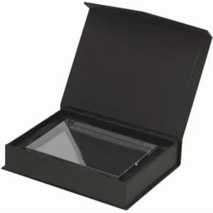 A black gift box partially open, containing a transparent rectangular item inside.