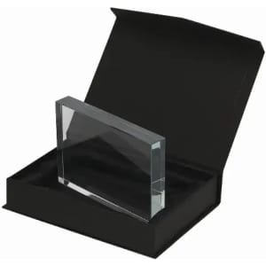 A clear crystal plaque displayed in a black gift box with a soft interior lining.