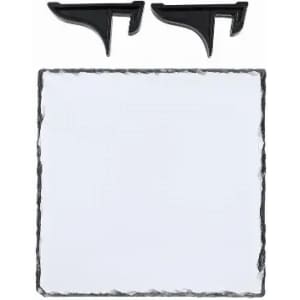 A slate serving board in a square shape with two black serving clips on top. It has a textured edge.