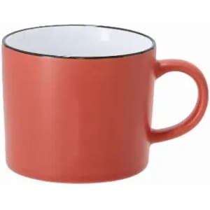 A coffee mug in coral red with a white interior and a black rim. It features a round handle.