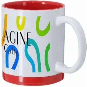 A coffee mug with a white exterior and red interior, featuring colourful abstract designs and a handle.