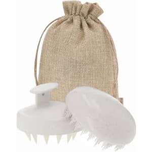 A hair scrubber and a silicone scalp massager in white, with a beige hessian drawstring bag.