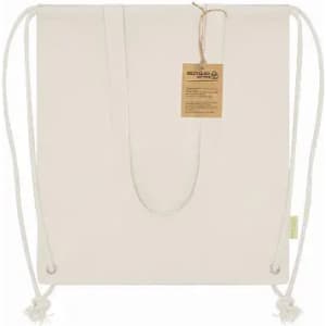 A tote bag in cream with drawstring closures, featuring a tag and a minimalist design. It has a rustic appearance.