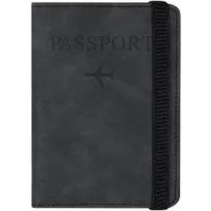 A black passport holder with an embossed design and an elastic band for closure. Features a logo.