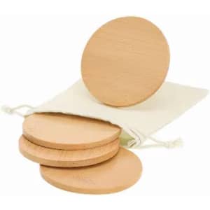 A set of wooden coasters with a natural finish, packaged in a drawstring pouch.