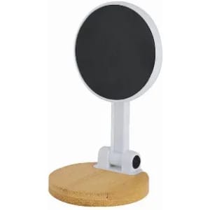 A round black mirror on a white arm, set on a circular wooden base.