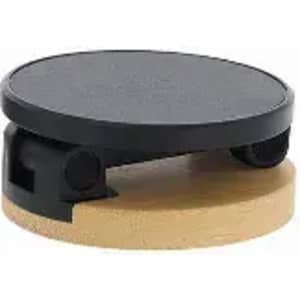 A black circular device with a wooden base, featuring a rotating mechanism and smooth surface.