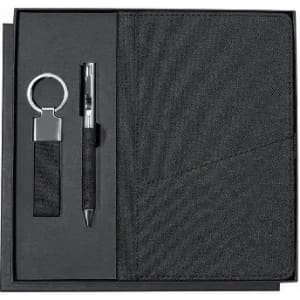 A gift set featuring a black notebook, pen, and keyring, all presented in a sleek black box.