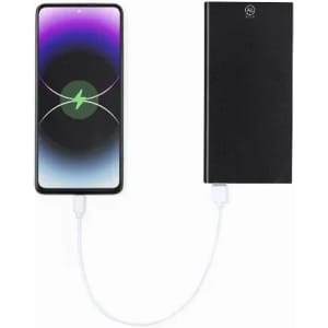 A power bank in black connected to a smartphone, displaying a charging graphic on the screen.