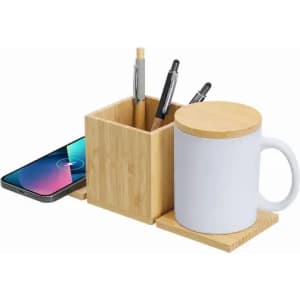 A bamboo organiser with a square pot for pens and a white mug, alongside a spot for a mobile phone.