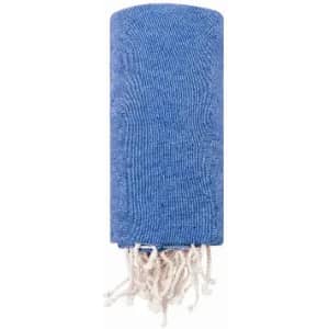 A blue towel with a textured pattern and white fringes at one end, neatly rolled up.