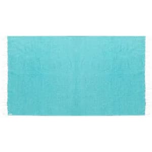 A bright aqua-blue beach towel with fringed edges, featuring a textured surface. It has a logo in one corner.