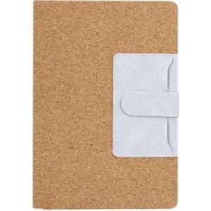 A notebook with a cork cover and a light grey closure strap. It features a simple design without visible branding.