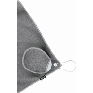 A grey face mask with a loop for attachment, displayed against a light background. It features a small logo tag.