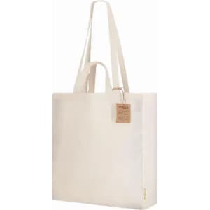 A tote bag in natural canvas with long handles and a tag, featuring an unadorned, minimalist design.