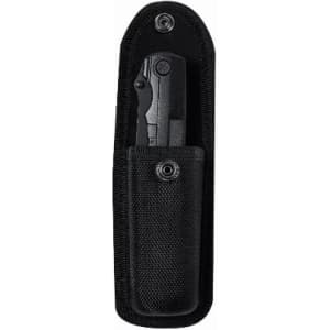 A black knife in a black sheath made of durable material, featuring a secure button and belt clip.