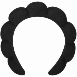 A headband with a scalloped design in black, featuring multiple rounded sections. It has no logos or text.