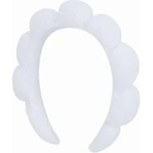 A white headband featuring a scalloped design, made from soft material. It has a simple, elegant look.
