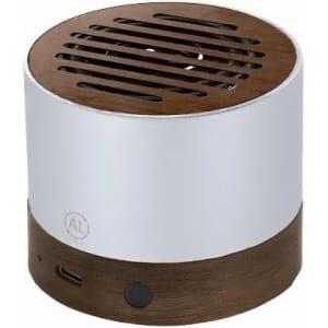 A portable speaker with a white upper section and a wooden base, featuring a grille on top and control ports on the side.
