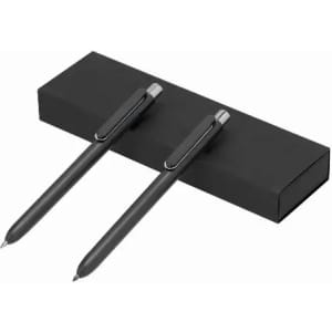A pen set featuring two black pens with metallic clips, presented in a black box.