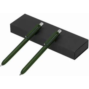 A set of two green pens resting on a black box, featuring a sleek design and silver accents.