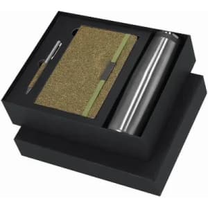 A gift set featuring a silver drink bottle, a gold notebook, and a pen, packaged in a black box.