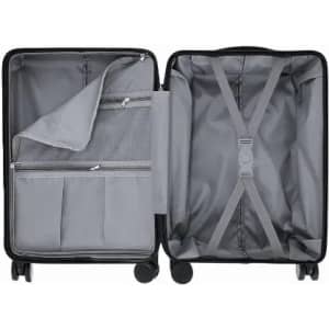 A suitcase with a black exterior and grey interior, featuring compartments and securing straps.
